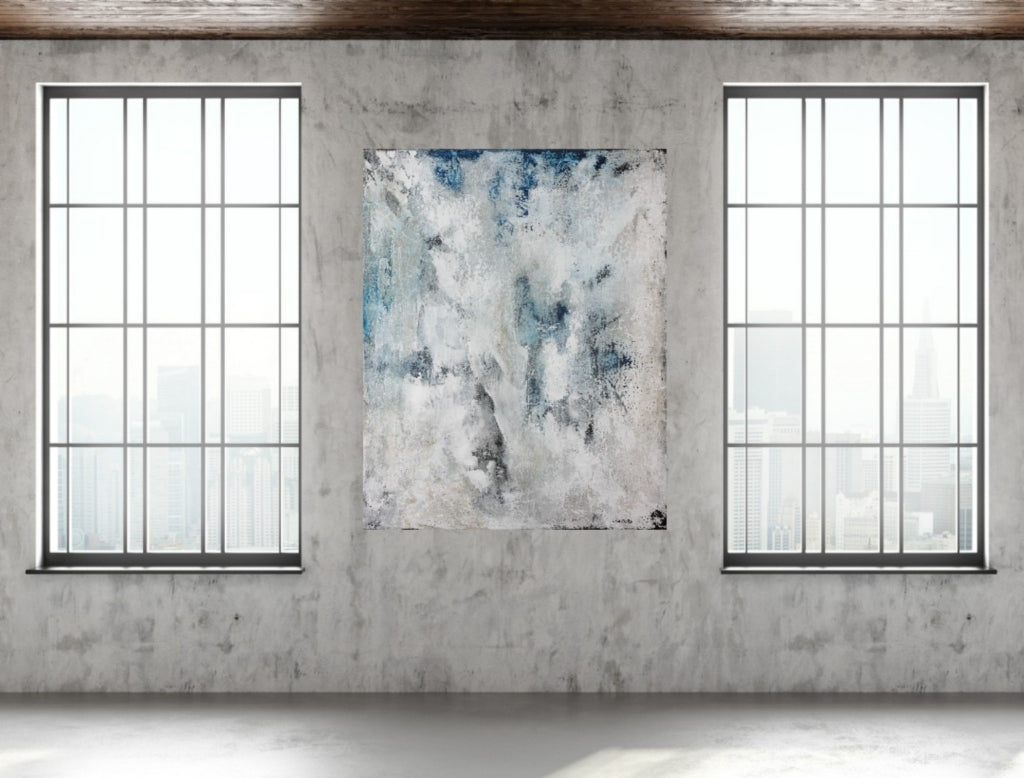 Blue-themed contemporary abstract art in industrial loft interior.