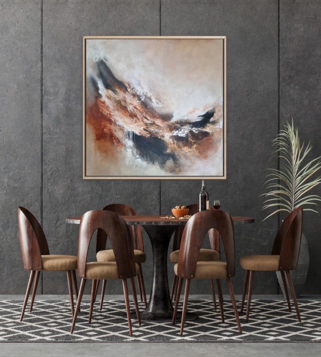 Large abstract acrylic painting with warm autumn colors. In a modern style dining room with gray walls and wooden furniture.