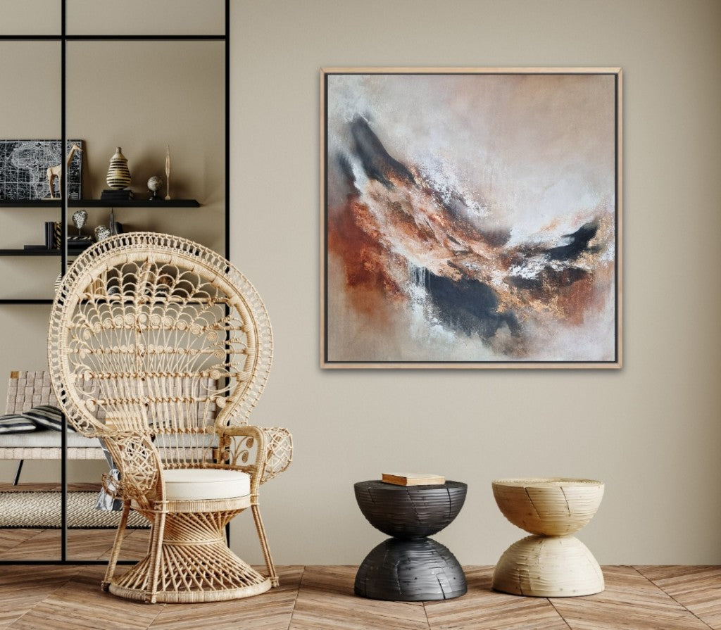 Large abstract acrylic painting with warm autumn colors. In a scandi-boho style living room.